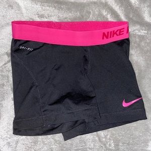 Black and pink Nike pros